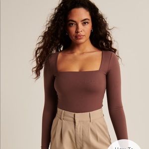 Barely worn brown square neck top. So stretchy and nice. Worn once.